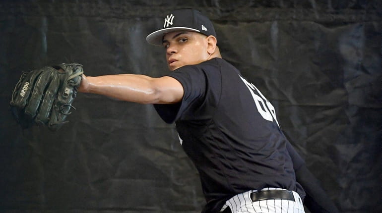 Yankees pitcher Dellin Betances throws a bullpen session during spring...