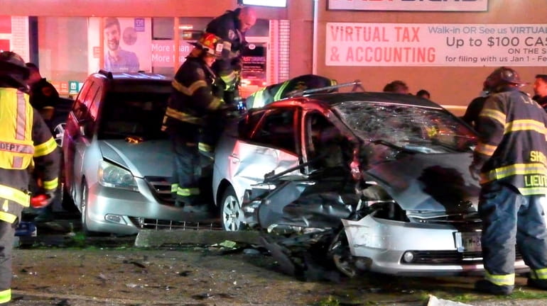 Firefighters on the scene of the fatal car crash at the...