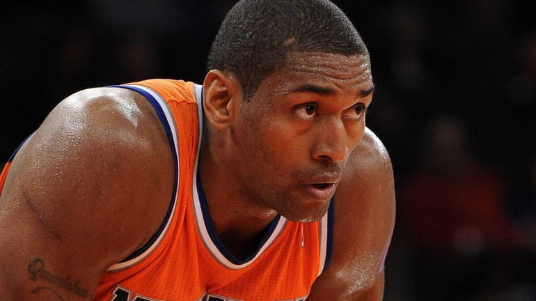 Knicks' Metta World Peace looks on from the court against...