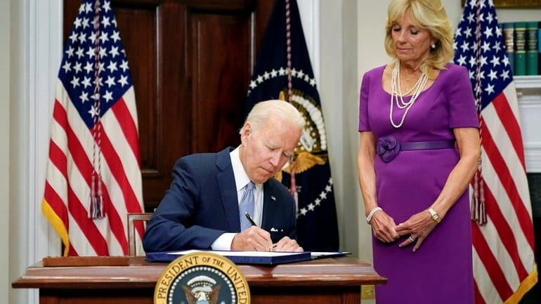 President Joe Biden signs into law the Bipartisan Safer Communities...