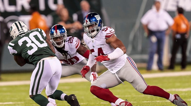 Janoris Jenkins and Olivier Vernon of the Giants look to...