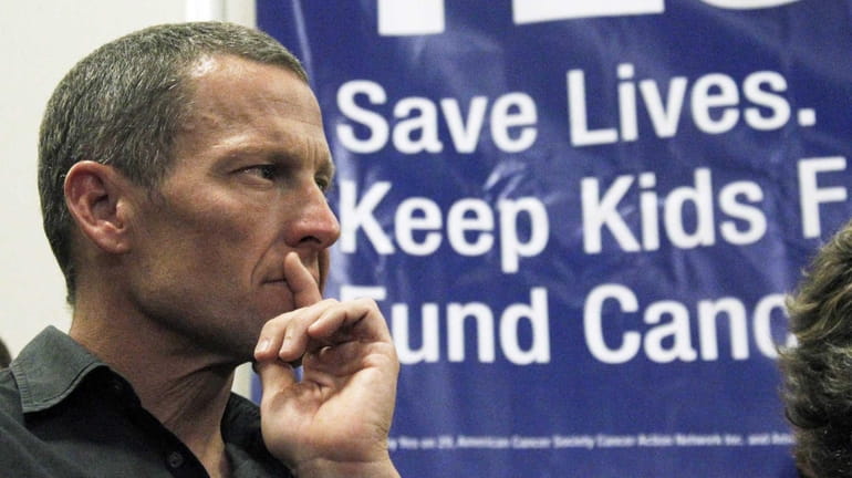 Lance Armstrong attends a rally at a news conference at...