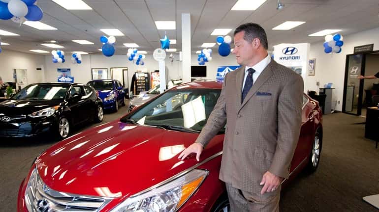Michael Brown, co-owner of the Atlantic Auto Mall in West...