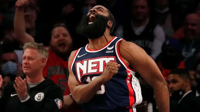 James Harden #13 of the Nets reacts after a basket...