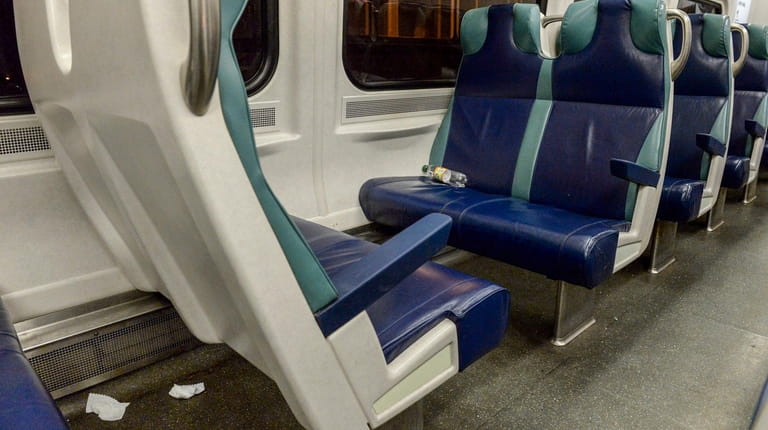 Trash is visible on a rush-hour LIRR train on the...