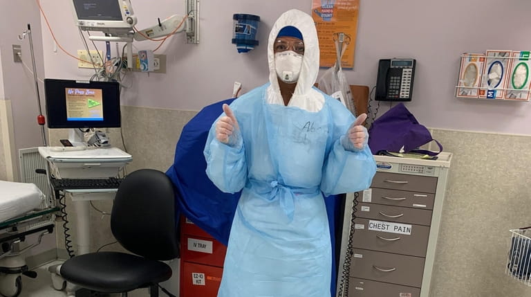 Nurse Abigail Desmond, 26, of Bayport, wearing protective gear at...