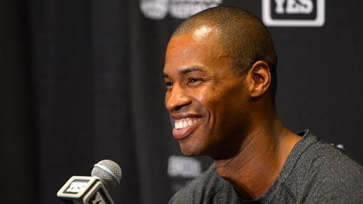 Nets center Jason Collins speaks during a news conference before...