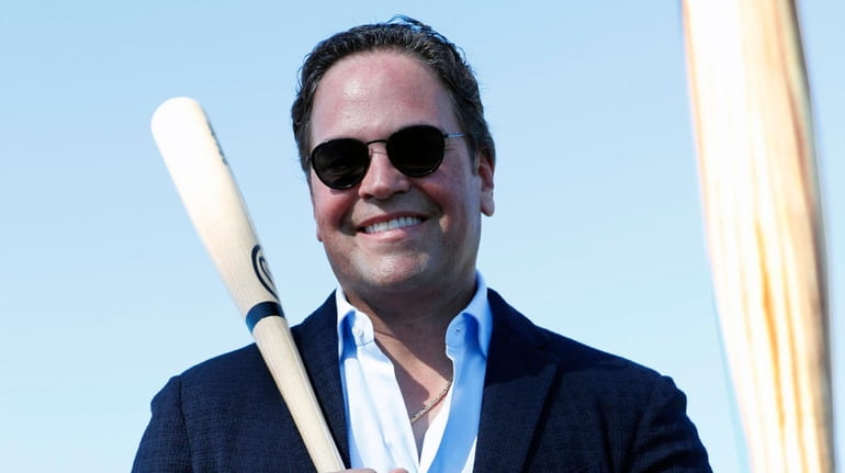 Former Mets catcher Mike Piazza poses for a photo under a...