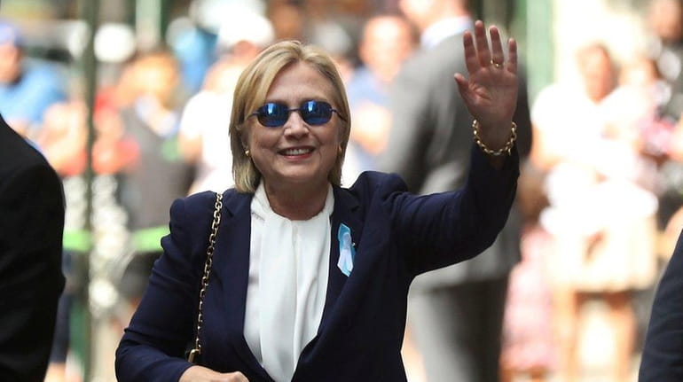 Democratic presidential candidate Hillary Clinton waves after leaving daughter Chelsea...