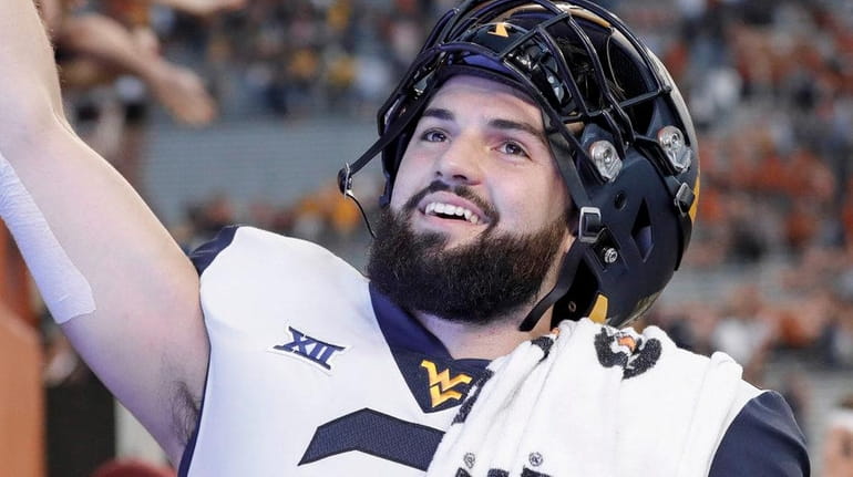 West Virginia QB Will Grier celebrates after the game against...