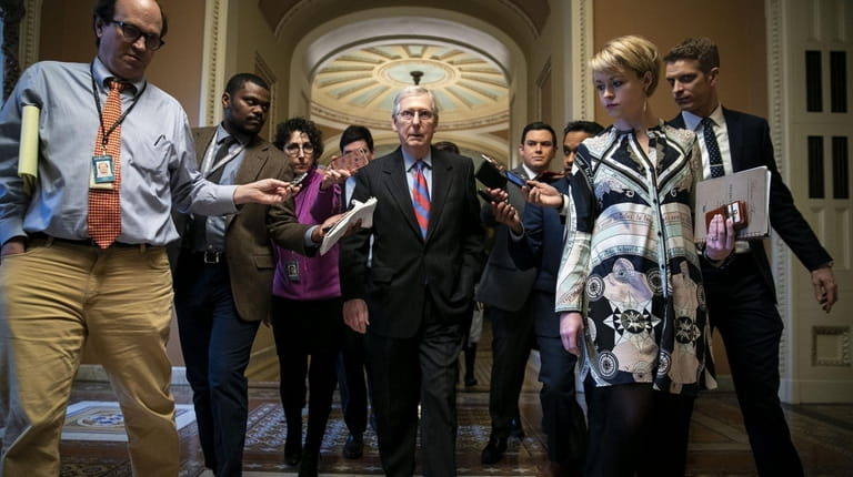 Senate Majority Leader Mitch McConnell (R-Ky.) speaks with the media after the...