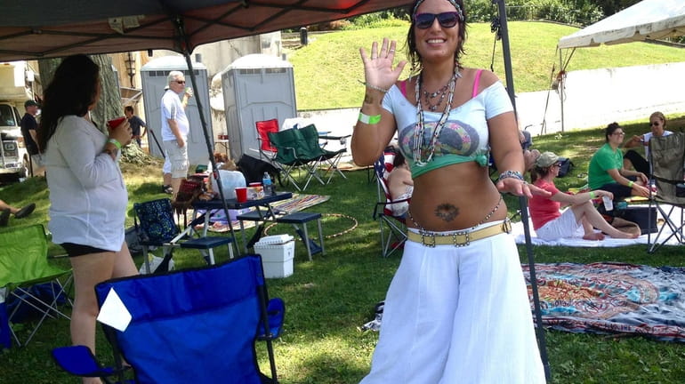 Luana Halili, 33, of North Bellmore, dances to the reggae...