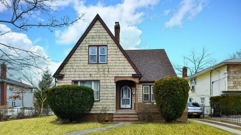 This three-bedroom, 1½-bathroom Cape is listed for $449,999 in Hempstead.