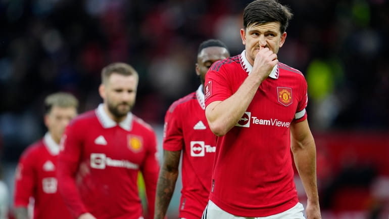 Manchester United's Harry Maguire grimaces on the halftime during the...
