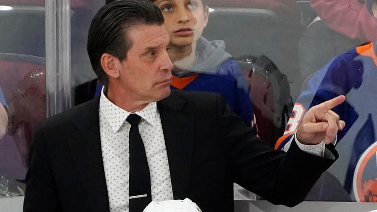 Islanders coach Lane Lambert gestures to the team during the...
