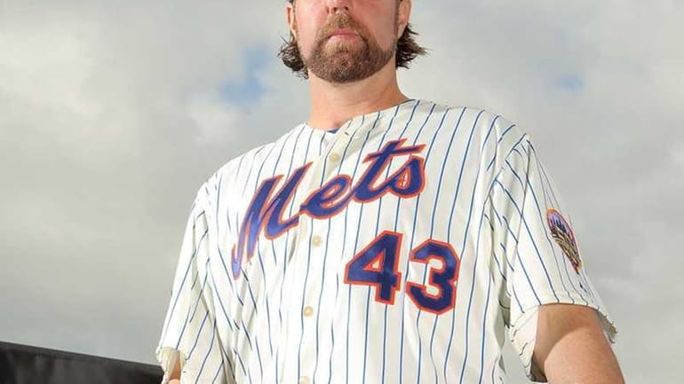 R.A. Dickey poses for photos during MLB photo day. (March...