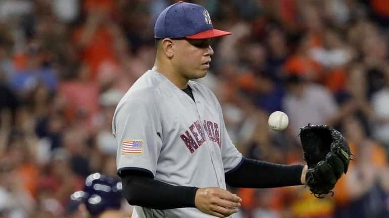 New York Yankees relief pitcher Dellin Betances tosses a new...