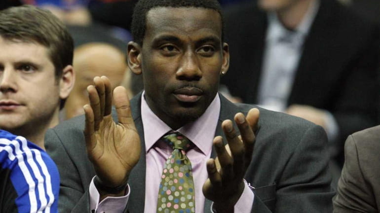 Amar'e Stoudemire of the Knicks cheers the team on from...
