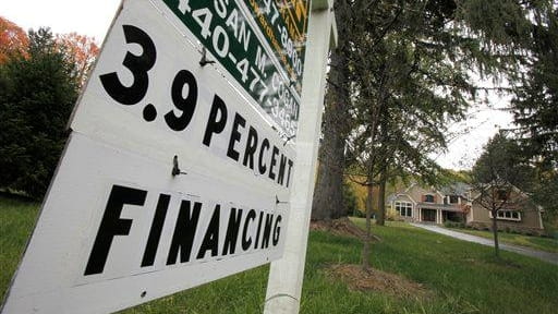 A sign for a newly-constructed home advertises a financing rate...
