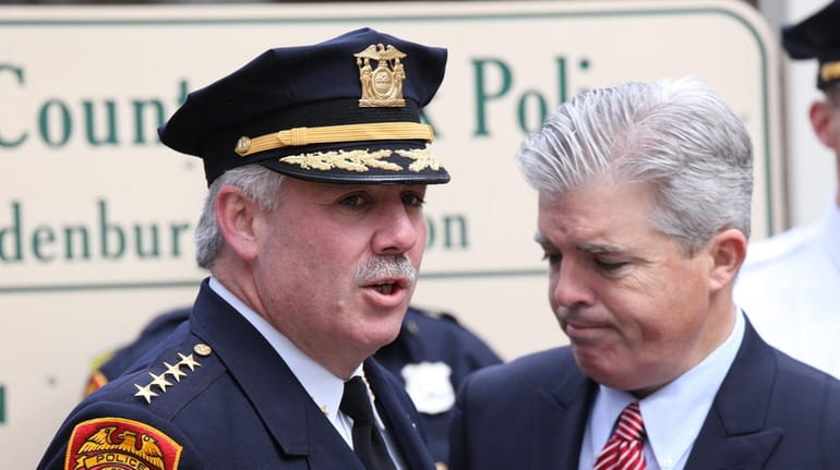Then-Suffolk County Police Chief James Burke speaks with Suffolk County...