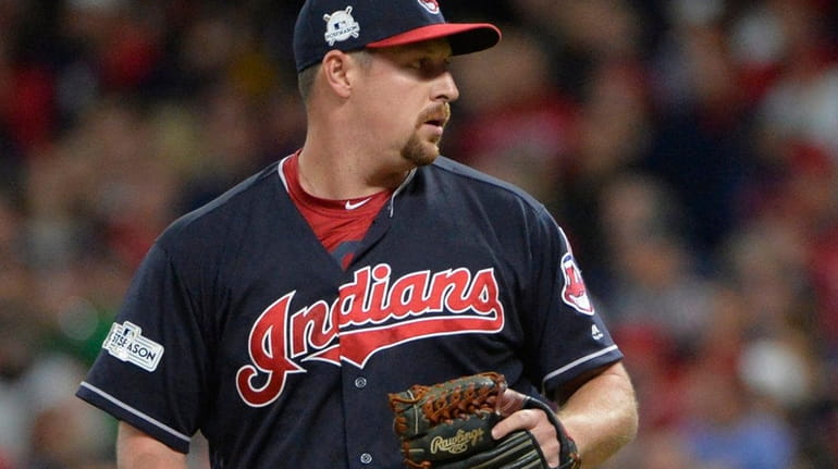 Indians relief pitcher Bryan Shaw pauses between pitches during Game...