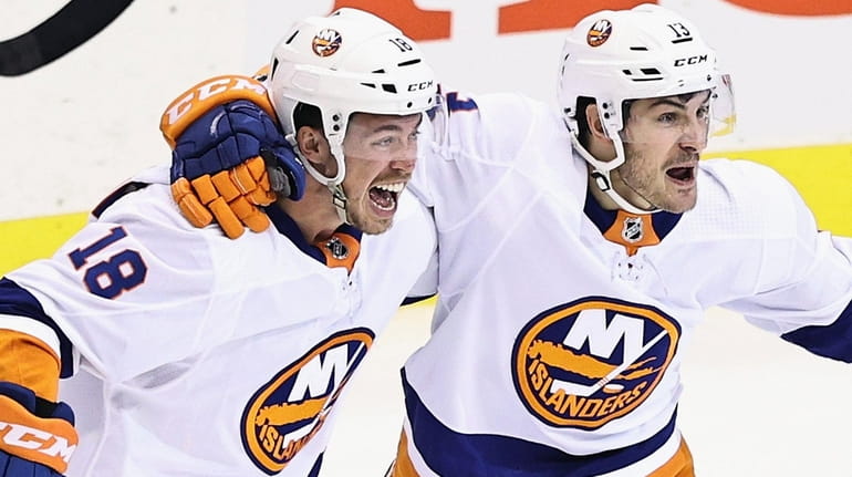 Anthony Beauvillier of the Islanders, left, celebrates his goal at 11:55 of...