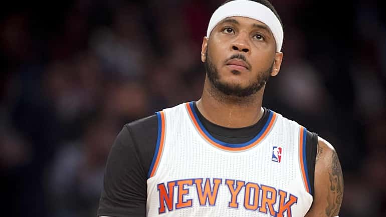 Carmelo Anthony looks on during the third quarter of a...