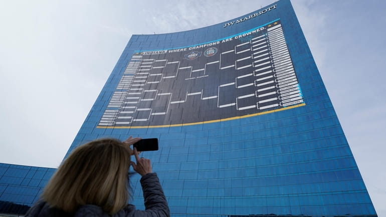 Lisa Moeller takes a photo of the bracket for the...