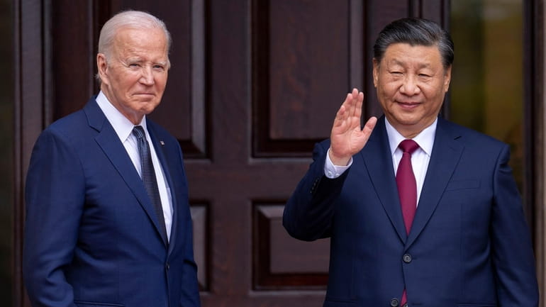 President Joe Biden, left, greets China's President President Xi Jinping...