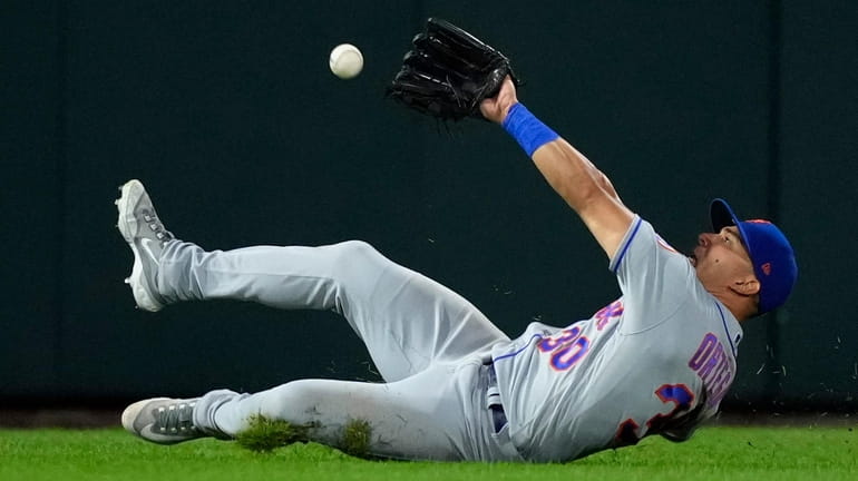 Mets leftfielder Rafael Ortega cannot catch a double by the...