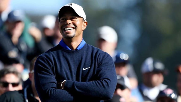 Tiger Woods smiles during a practice round prior to the...