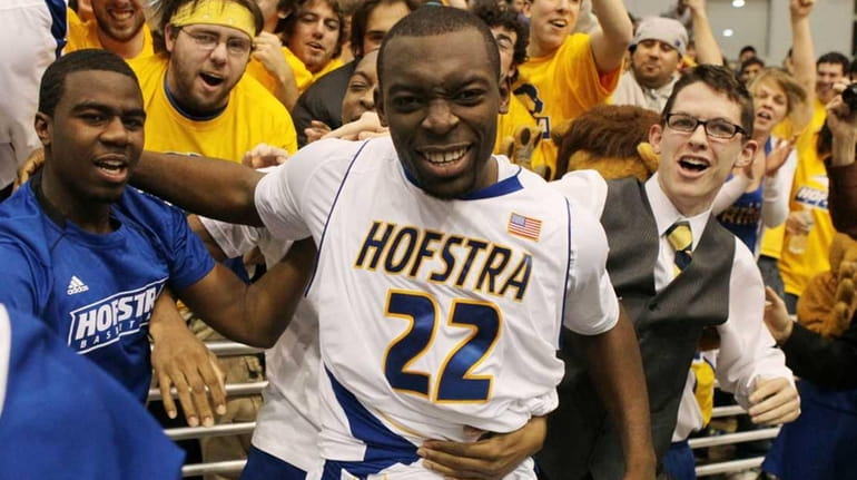 Hofstra's Charles Jenkins celebrates after hitting the game-winning three pointer...
