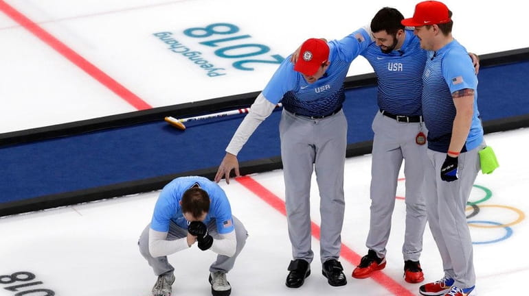 The U.S. team celebratse during the men's curling finals match...