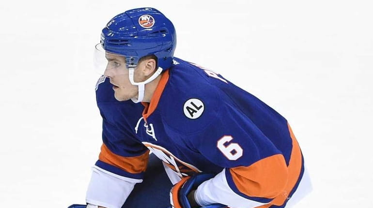 New York Islanders defenseman Ryan Pulock skates with the puck...