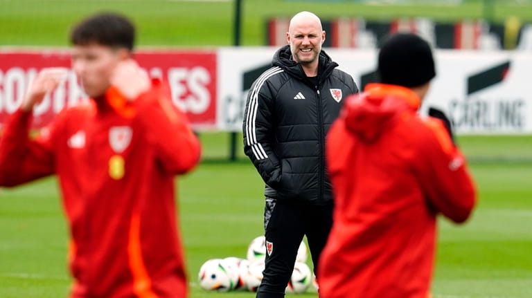 Wales' manager Rob Page watches over a training session at...