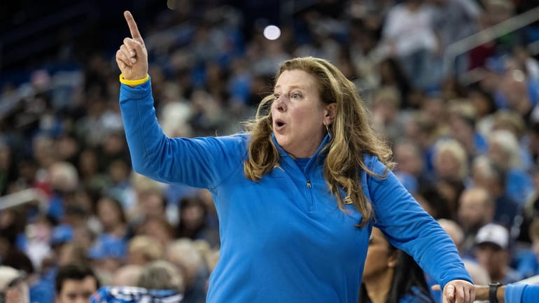 UCLA head coach Cori Close instructs her players in the...