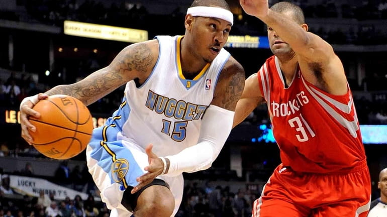 Denver Nuggets' Carmelo Anthony drives past Houston Rockets' Shane Battier...