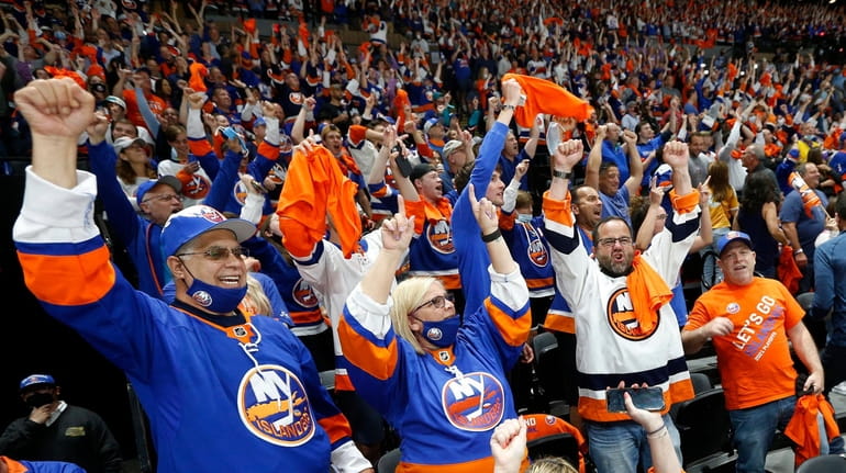  Islanders fans cheer a goal against the Penguins in Game...