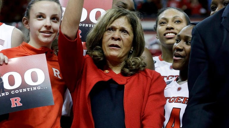 Rutgers head coach C. Vivian Stringer celebrates her 900th win...