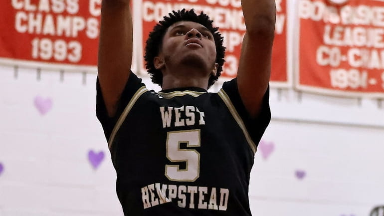 West Hempstead forward Isaiah Blunt converts the pass down low...