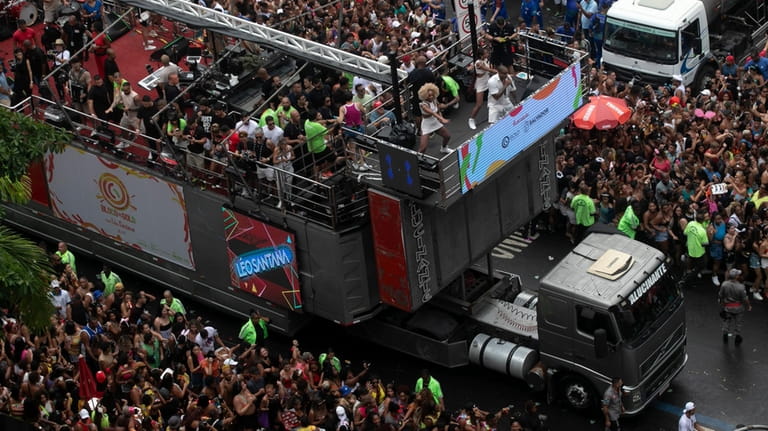 Brazilian singer Leo Santana performs on a sound truck popularly...