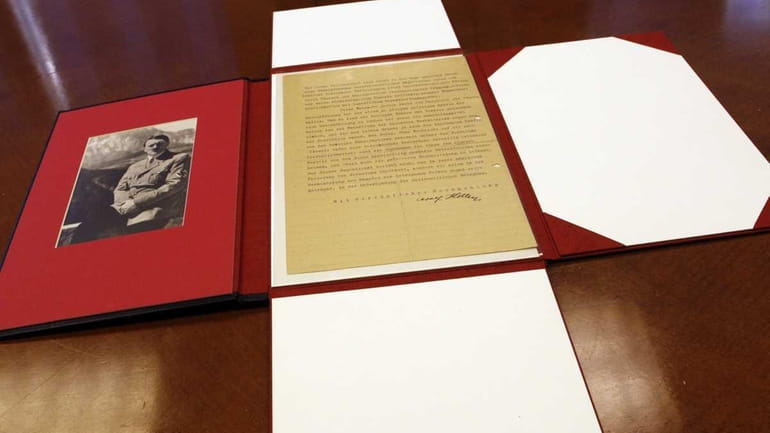 A letter written by Adolf Hitler is photographed in New...
