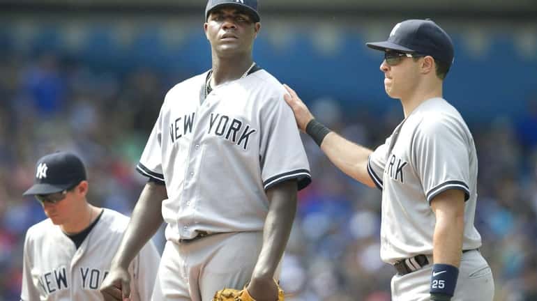 Yankees' starting pitcher Michael Pineda stands on the mound with...