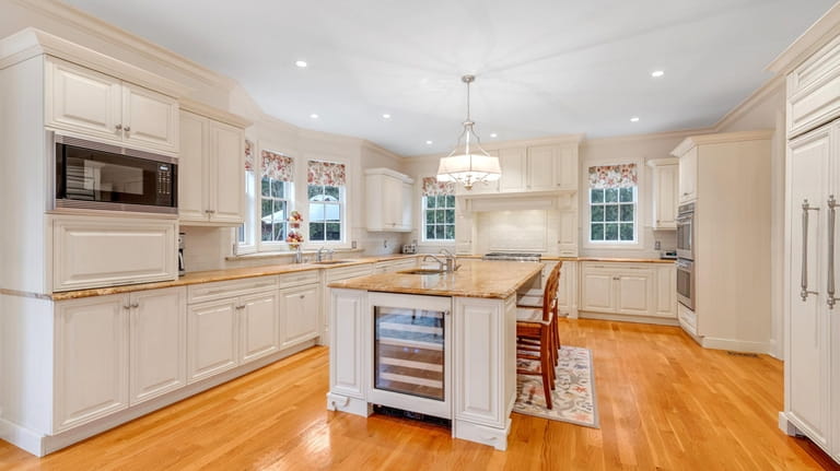 The kitchen features granite countertops.