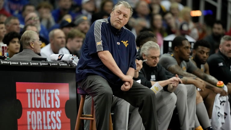 West Virginia head coach Bob Huggins watches during the first...