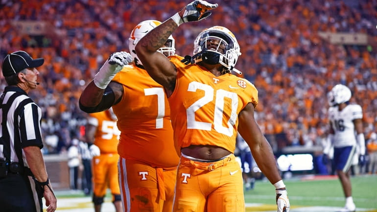 Tennessee running back Jaylen Wright (20) reacts to scoring a...