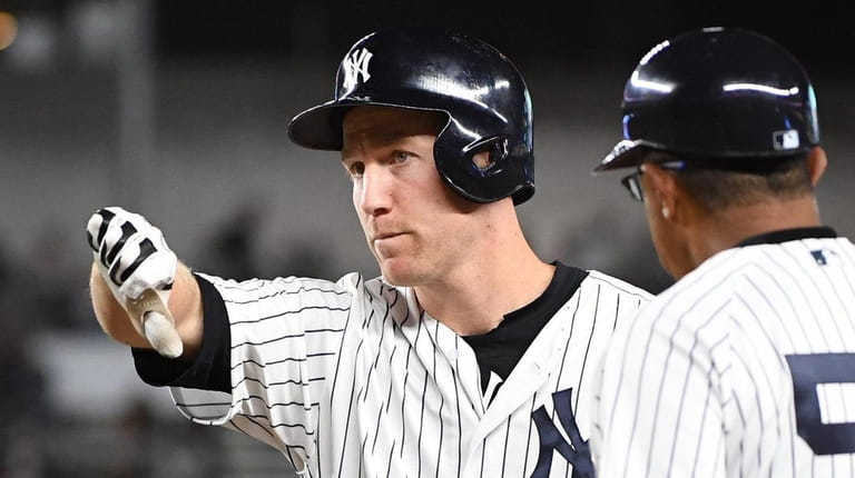 Yankees third baseman Todd Frazier gives a thumbs down after...