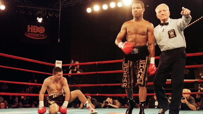 Shane Mosley is sent to a neutral corner by referee...