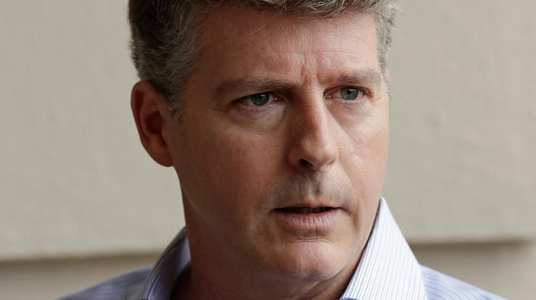Hal Steinbrenner, principal owner of the Yankees, talks with reporters...