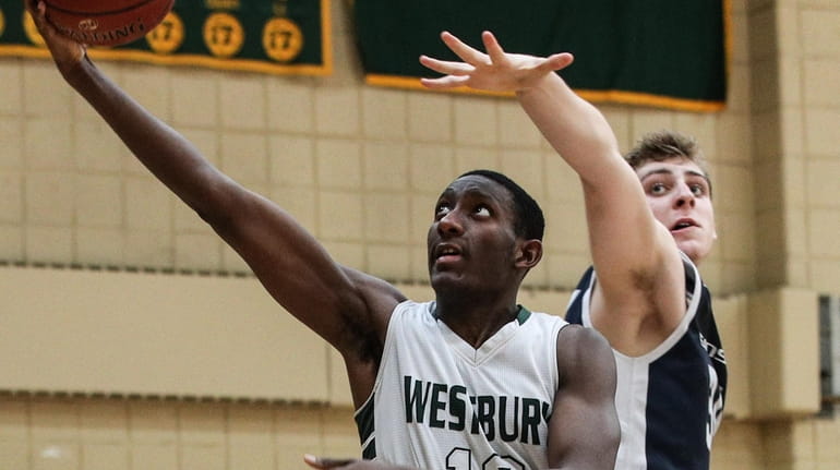 Isaiah Bien-Aise of Westbury takes the layup in front of...